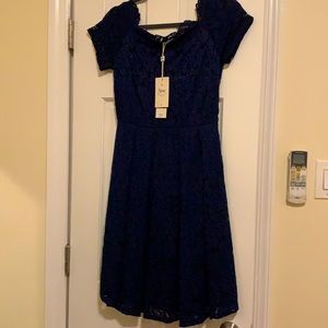 Navy lace dress. Never worn. Comfy fabric with slip underneath built in.